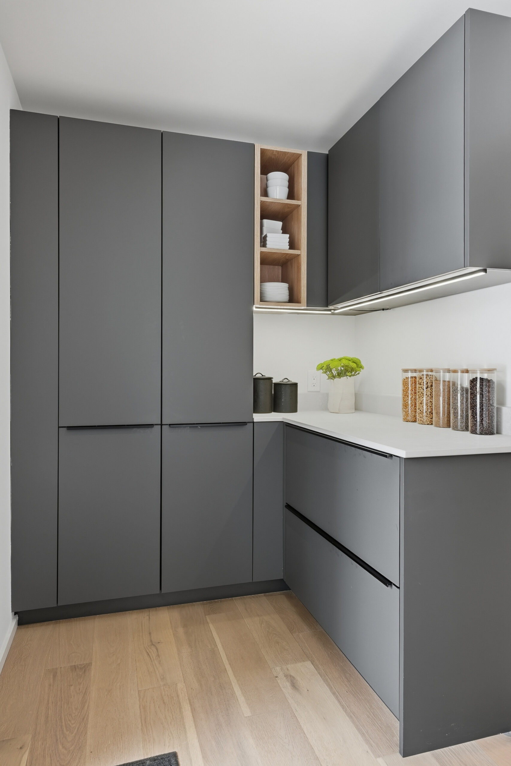 Modern kitchen cabinetry and storage solutions for professional photography.