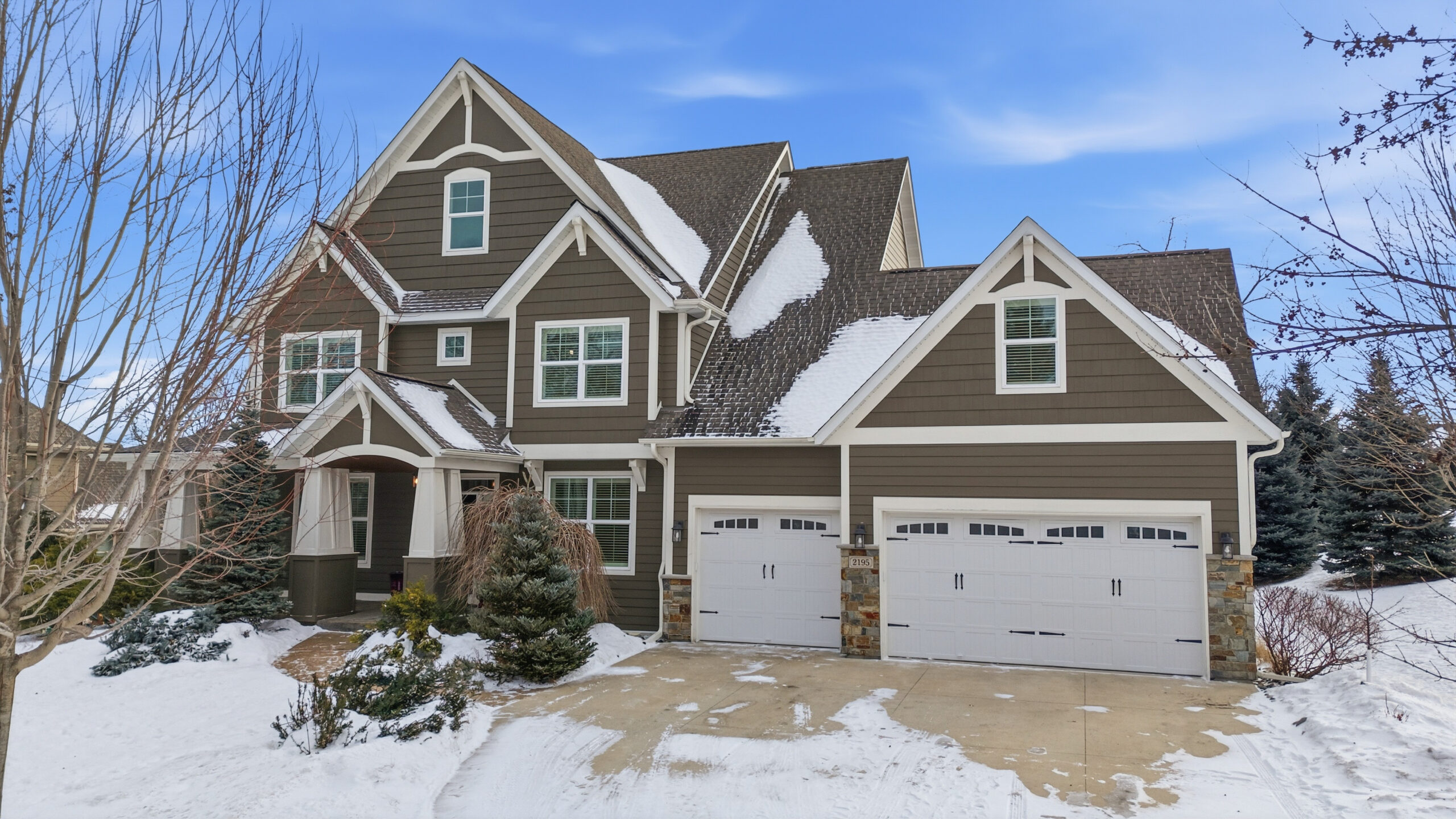 AI Twilight Image of a snow-covered home showcasing real estate photography services.