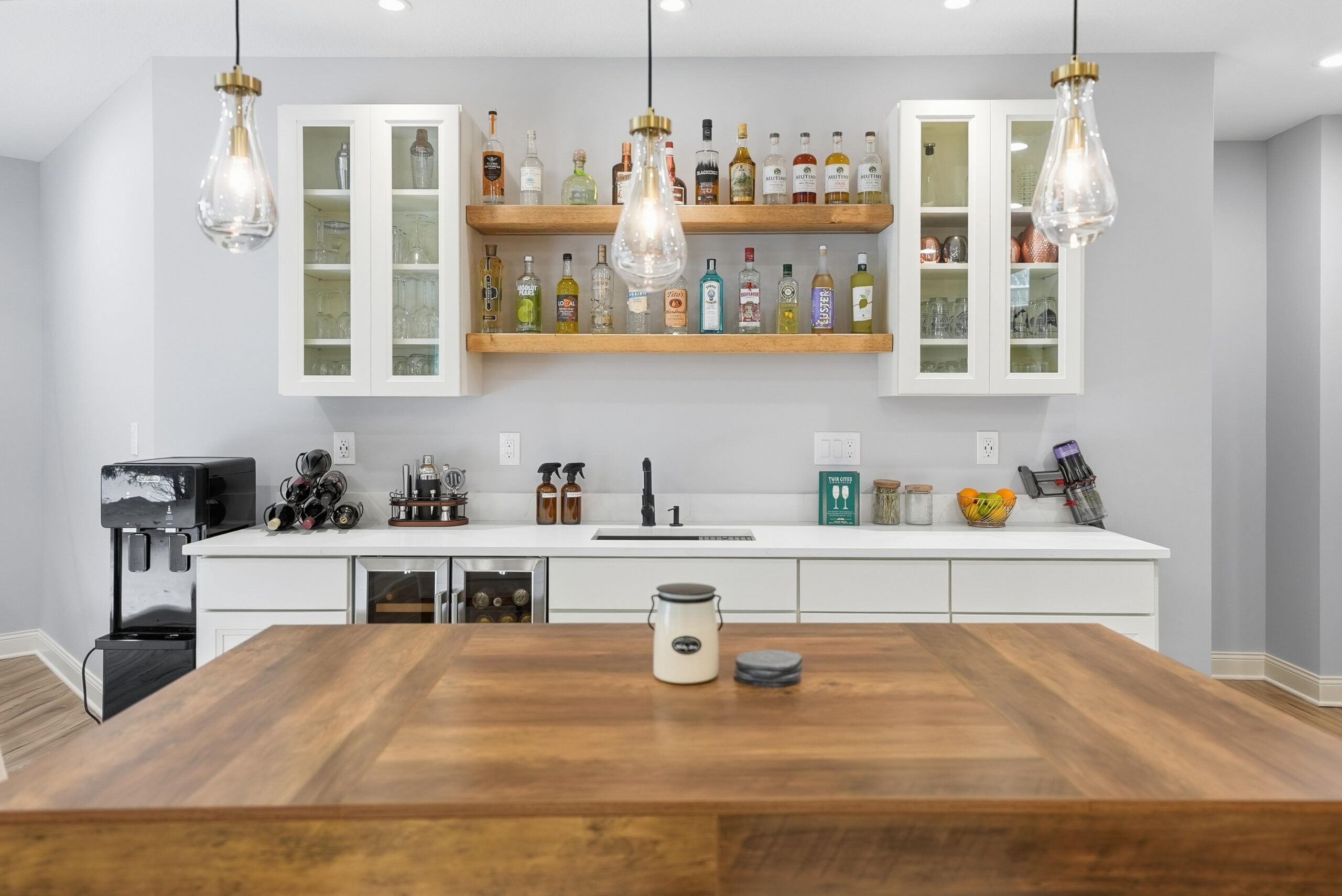 Stylish home bar interior showcasing photography for real estate marketing.