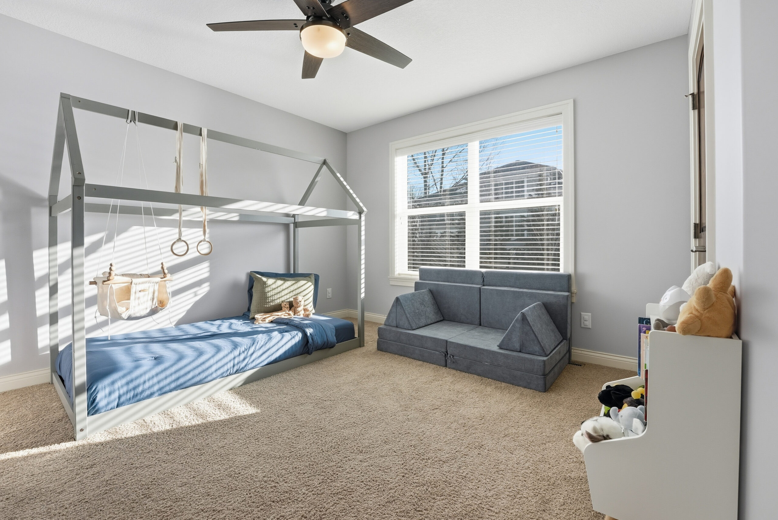 Interior photography showcasing a stylish bedroom with a unique bed frame and natural light.