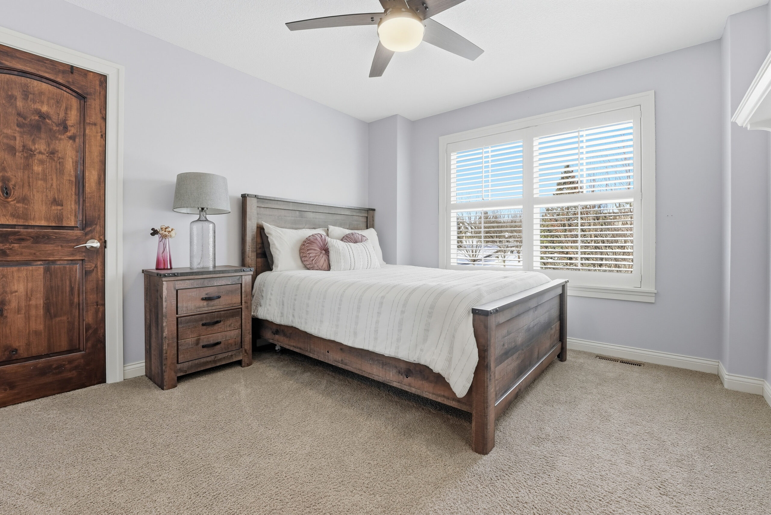 Real estate bedroom photography showcasing interior design and natural light.