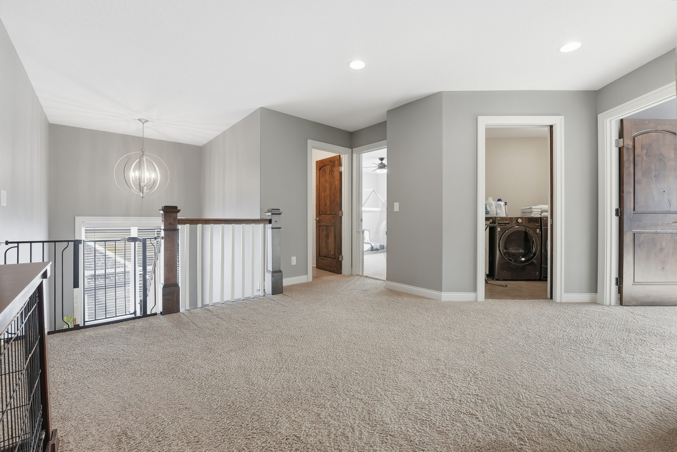 Interior hallway and laundry room showcasing real estate photography services.