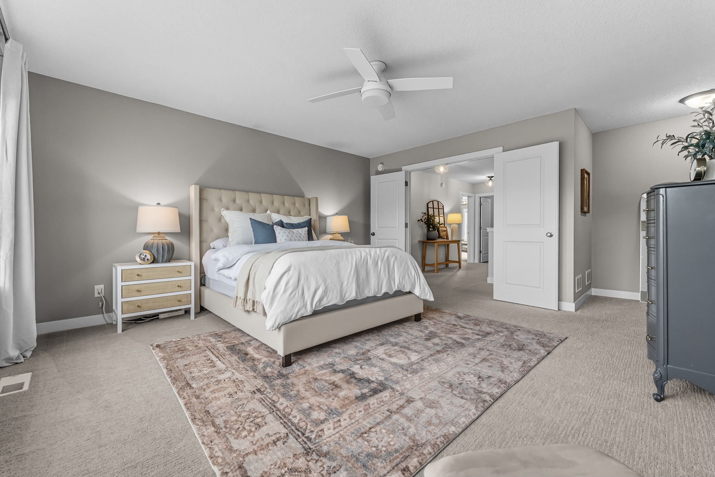 Real estate photography showcasing a stylish bedroom and interior design.