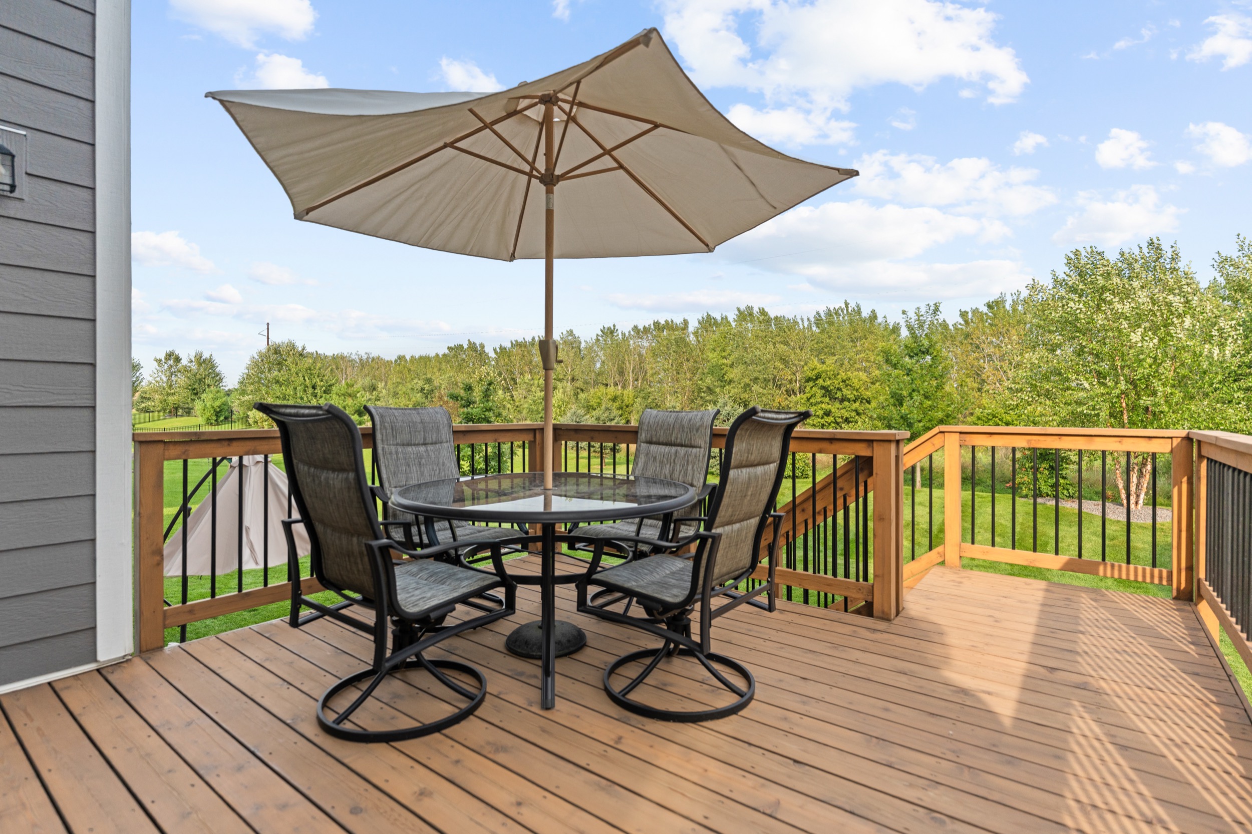 Outdoor patio with table and chairs showcasing real estate photography and videography services.