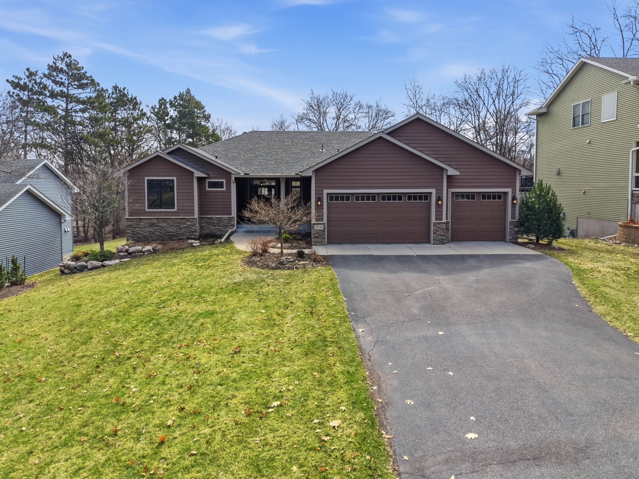Walkout rambler home at 1978 Thom Drive, Arden Hills, MN, with updated exterior and three-car garage.