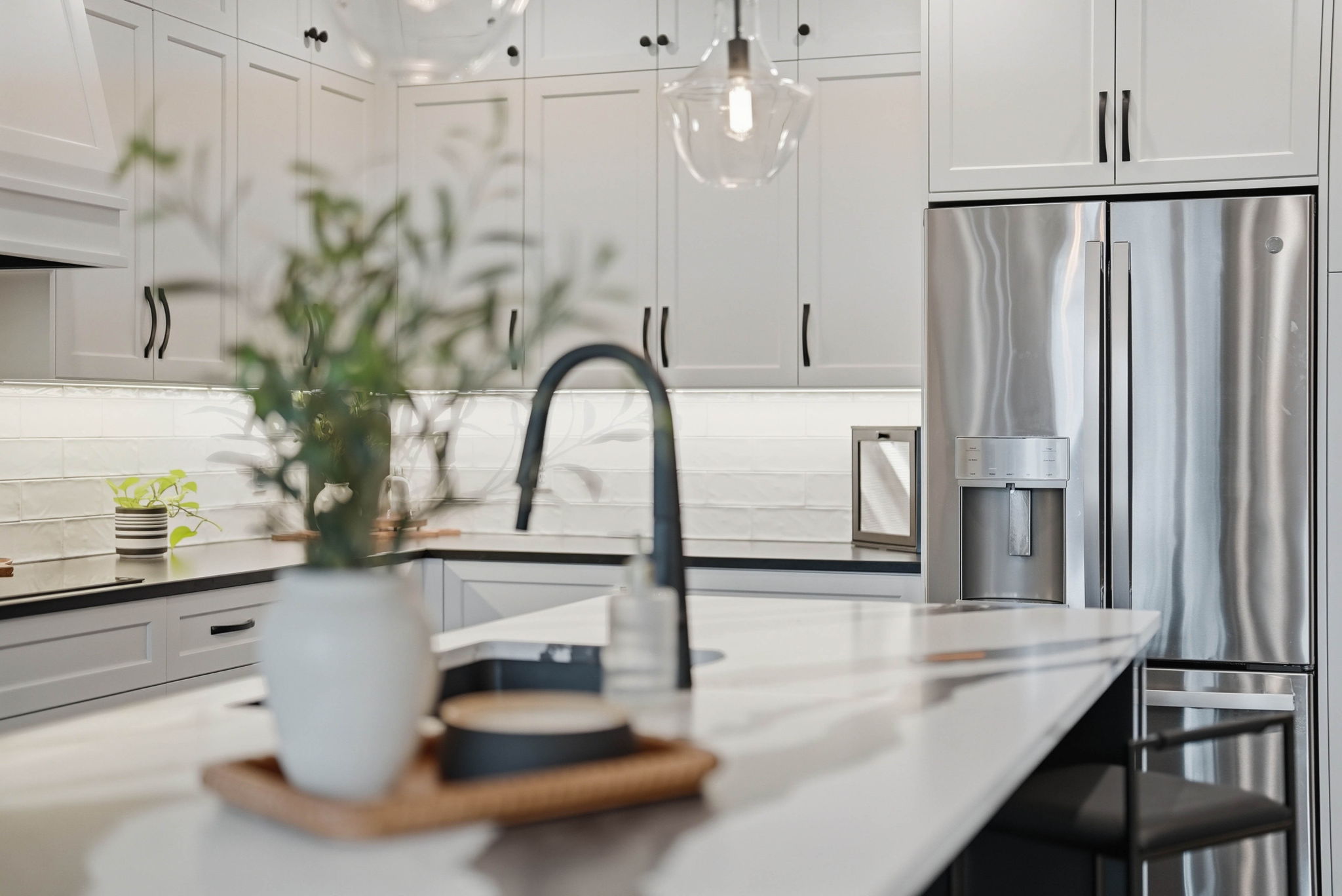 Remodeled kitchen with stainless steel appliances and modern fixtures in Arden Hills home.