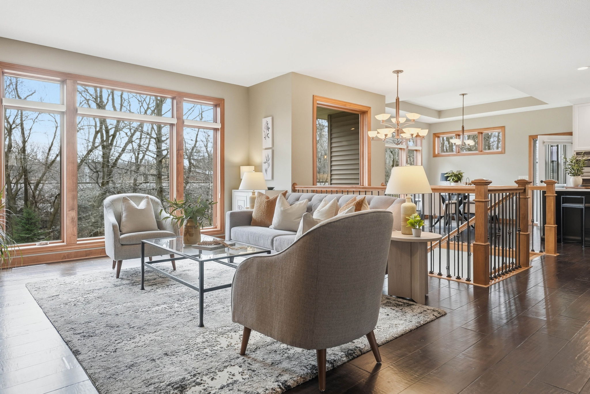 Updated Arden Hills walkout rambler living room with large windows and hardwood floors