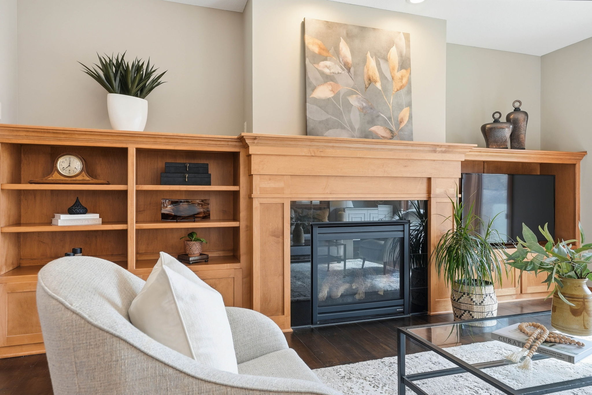 Walkout rambler interior featuring fireplace, built-in bookshelves, and updated finishes.