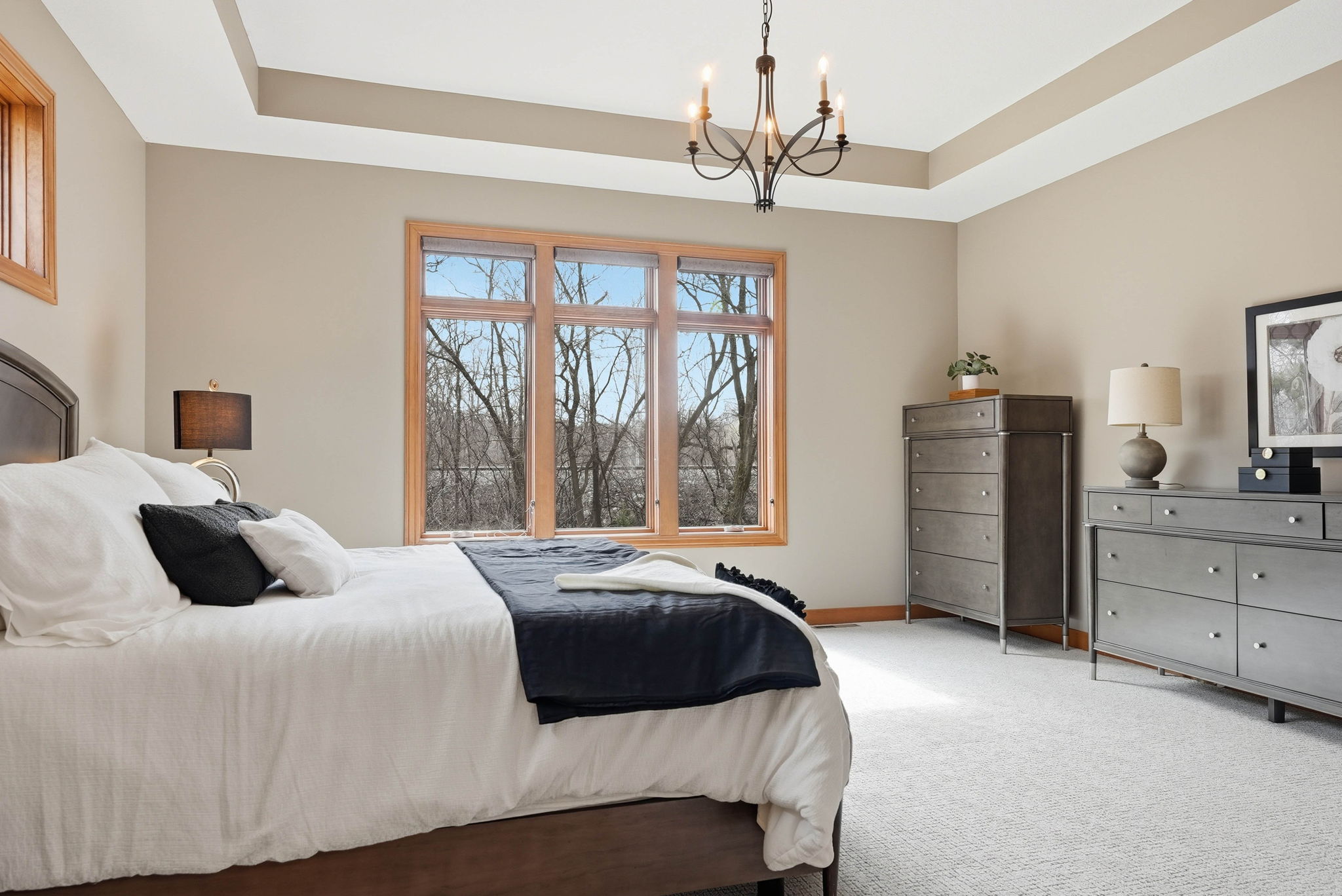 Remodeled bedroom in Arden Hills home with large windows and walkout lower level.