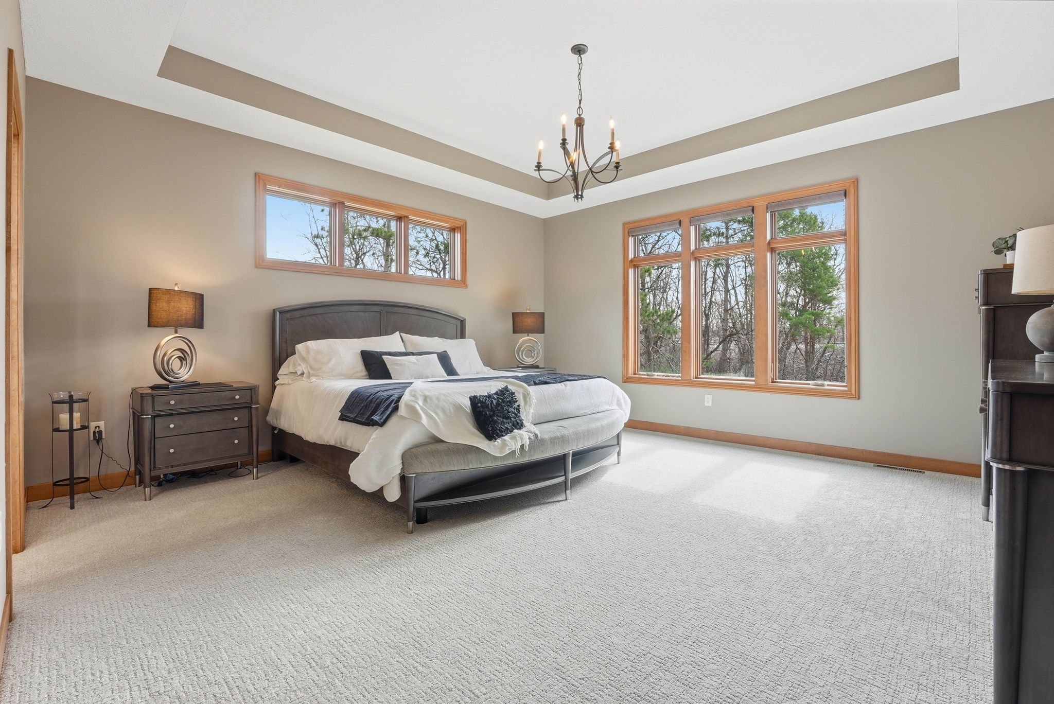 Remodeled bedroom in Arden Hills walkout rambler with large windows and modern lighting.