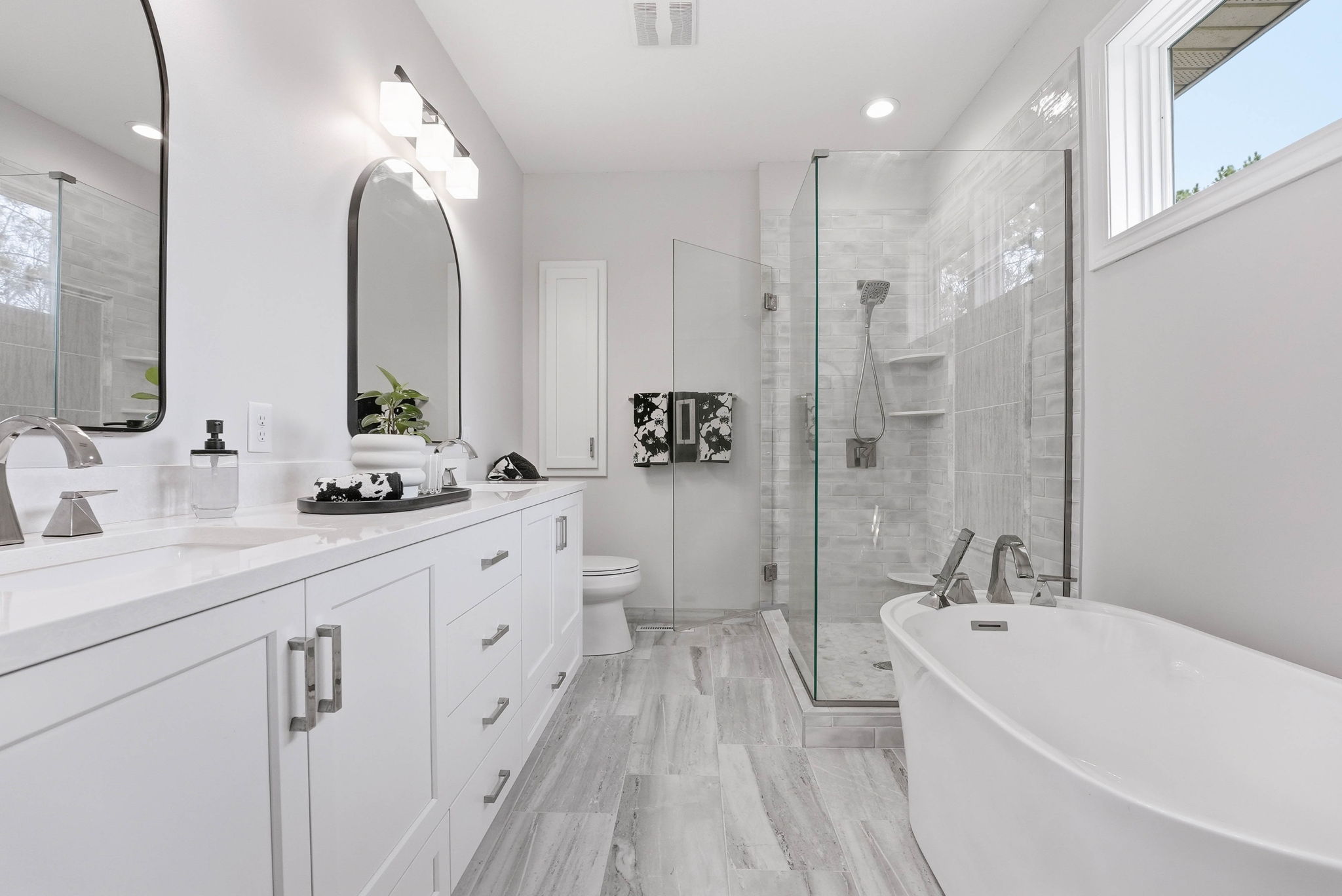 Remodeled bathroom with walk-in shower and modern vanity in Arden Hills home.