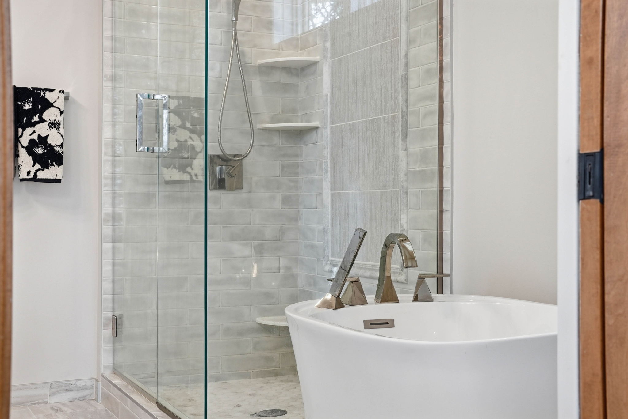 Modern walkout rambler bathroom with glass shower and updated fixtures.