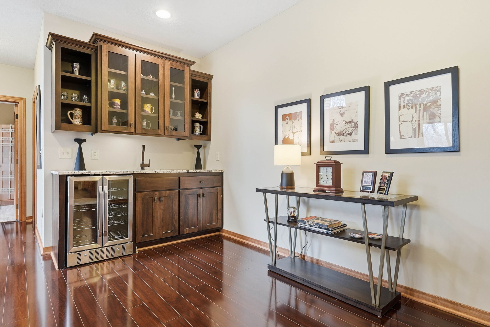 Updated kitchen with custom cabinetry, quartz countertops, and wet bar in Arden Hills home.