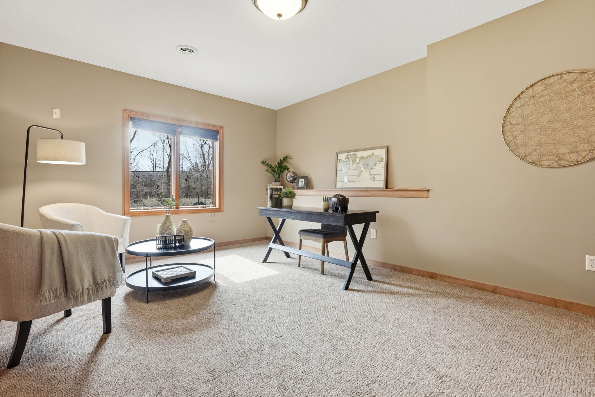 Updated Arden Hills home interior featuring desk, window, and cozy seating area.