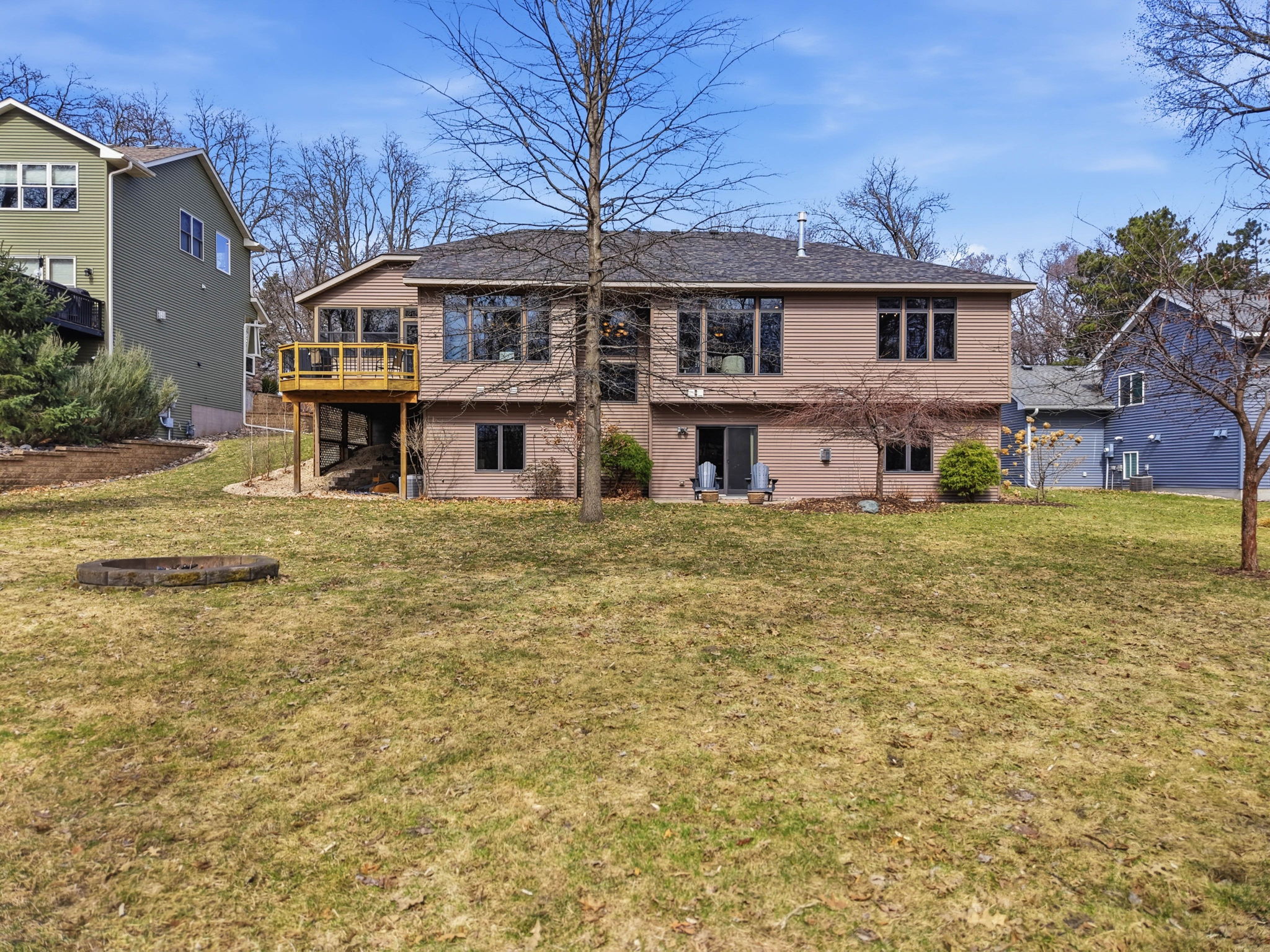 Walkout rambler exterior with deck and private backyard in Arden Hills, MN