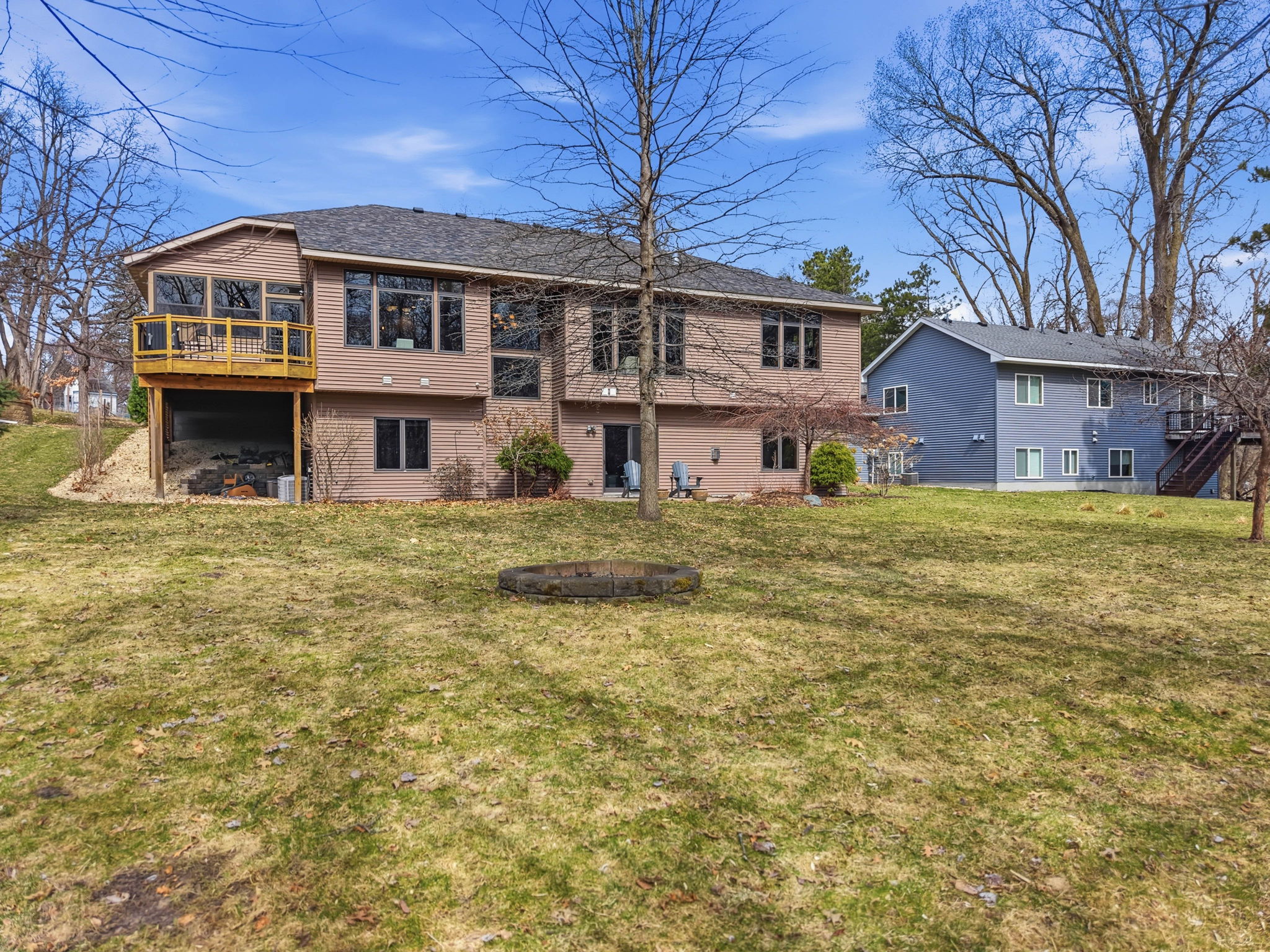 Walkout rambler exterior with deck and spacious backyard in Arden Hills, MN