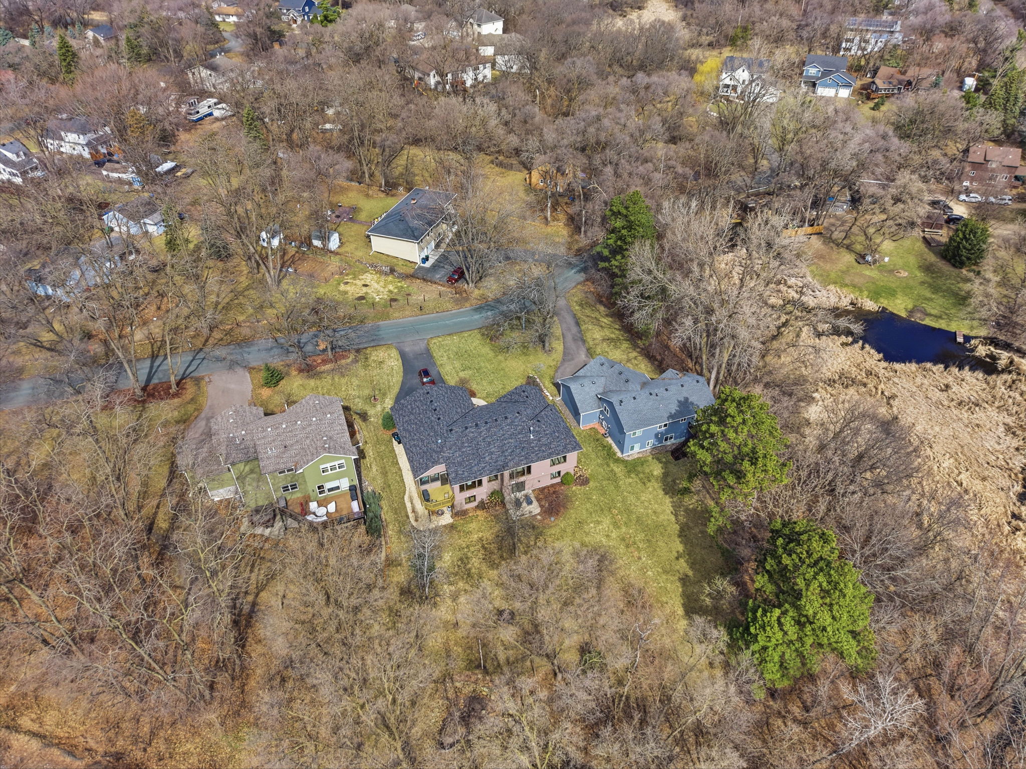 Aerial view of Arden Hills home and surrounding neighborhood, walkout rambler with private backyard and nearby lake
