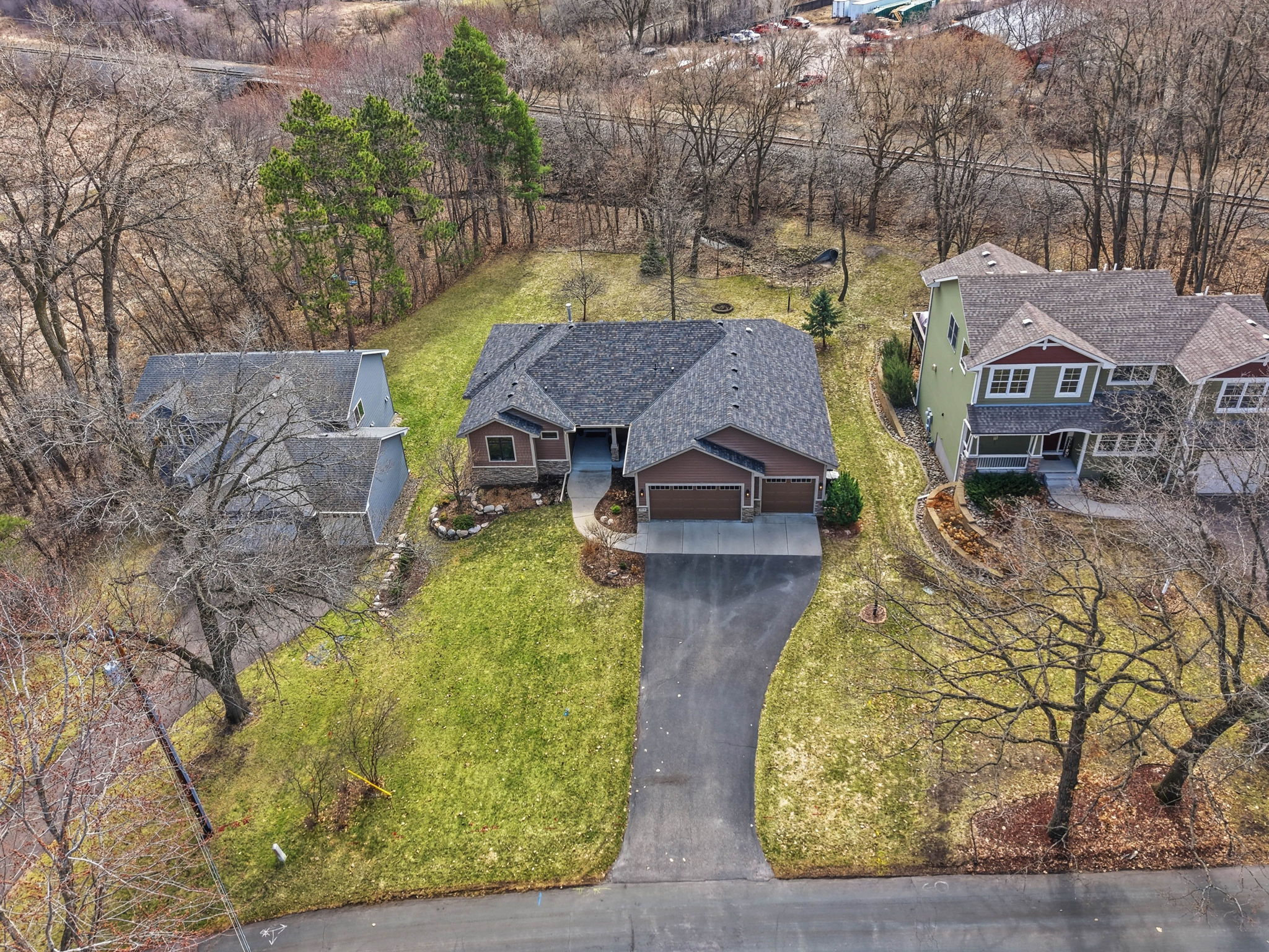 Aerial view of walkout rambler home in Arden Hills, MN, with updated exterior and private backyard.